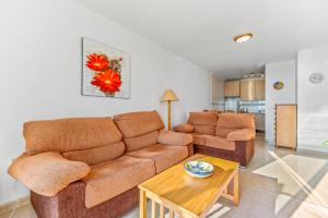 a living room with a couch and a table at Apartment in Bolnuevo in Bolnuevo