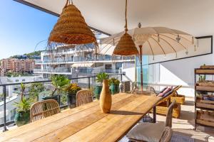 a dining room with a table and views of the city at Sea View near La Cala & Marbella in Mijas Costa