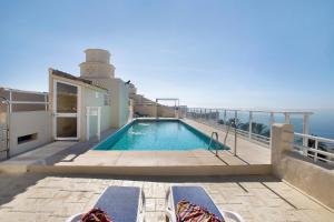 a swimming pool on a cruise ship with a lighthouse at Luxury in Puerto Marina in Benalmádena