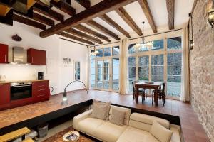 a living room with a couch and a table at Altes Kutschhaus in Gernsbach