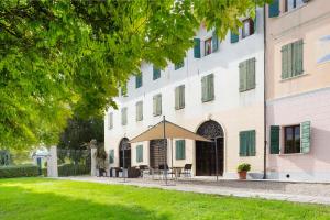 a building with a tent in front of it at Villa Bivai in Bivai