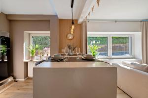 a kitchen with a large island in the middle at My Little Suite in Illingen