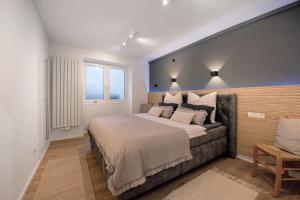 a bedroom with a large bed and a window at My Little Suite in Illingen
