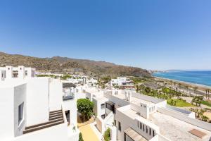 an aerial view of white buildings and the ocean at Duplex jlc in Mojácar