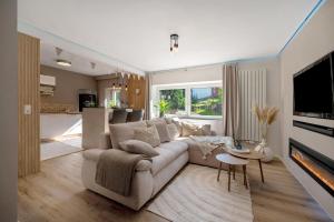 a living room with a couch and a fireplace at My Little Suite in Illingen