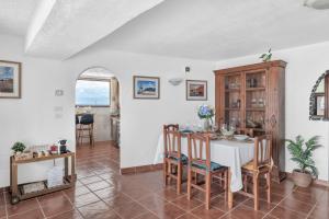 a dining room with a table and chairs at Villalmar in Famara