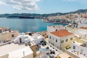 an aerial view of a city with water and buildings at Artrock Experience Loft Gallery in Ermoupoli