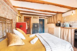 a bedroom with a large bed in a room at Duende in Olba +10 photos
