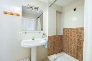 a bathroom with a sink and a mirror at Brisas Vista Mar in Sa Ràpita +23 photos