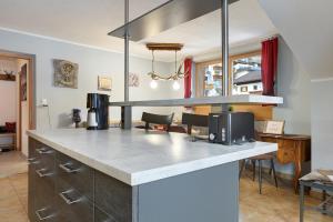 a kitchen with a white counter top in a room at Xxl-appartement Moarhof in Sand in Taufers +32 photos