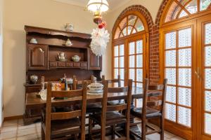 a dining room with a wooden table and chairs at Poggio Loccano in Montevarchi
