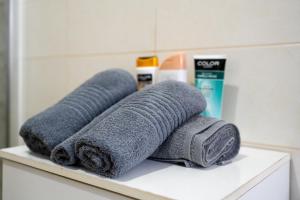 a pile of towels sitting on a shelf in a bathroom at Poggio Loccano in Montevarchi +26 photos