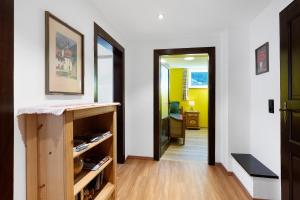 a hallway with a door leading into a room at Haus am See - Wohnung Jenner in Schönau am Königssee