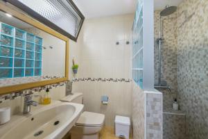 a bathroom with a sink and a toilet and a shower at Casa Carolina Y Roger Tazacorte in Tazacorte +19 photos