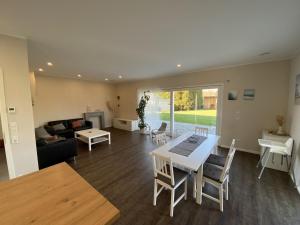a living room with a table and a couch at Ferienwohnung Repetal in Attendorn +36 photos