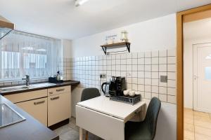 a kitchen with a table with a coffee maker on it at Ferienwohnung Knittlingen in Knittlingen