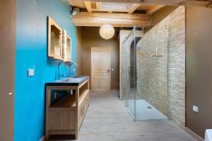 a bathroom with a glass shower and a sink at Chalet Aussois Lerovi in Aussois +33 photos