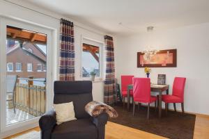 a living room with a table and chairs and a dining room at Ferienwohnung Christa in Sankt Märgen +20 photos