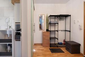 a room with a room with shelves and a door at Blackforest Perla in Höchenschwand