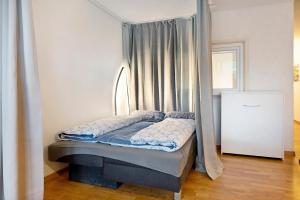 a bed with a canopy in a room at Blackforest Perla in Höchenschwand