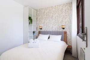 En eller flere senge i et værelse på Trouville Escapade