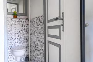 a bathroom with a toilet and a mirror at T2 Le Panorama in Cassis +14 photos