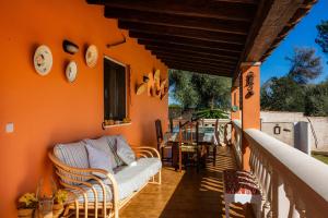 a living room with a couch on a porch at Can Pota in Portocolom