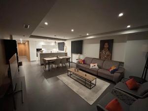 a living room with a couch and a table at Blue infinity 7 in Cumbre del Sol