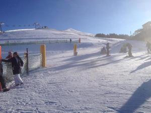 a group of people standing on a ski slope at Il Focolare dei Sibillini in Visso