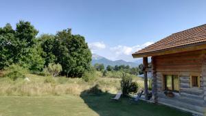 a log cabin with two benches outside of it at Le Chalet Neige in Chorges +7 photos