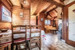 a bedroom with a bed in a room with wooden walls at Chalet 6p Simple - Patchy in Verchaix +13 photos