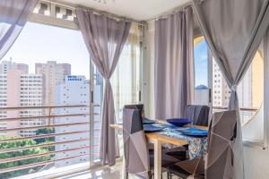 a dining room with a view of the city at Moby Dick in Benidorm