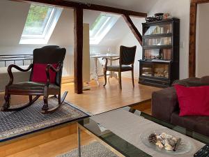 a living room with a couch and a chair at Haus Haselmaus - Buntspecht in Schwäbisch Gmünd
