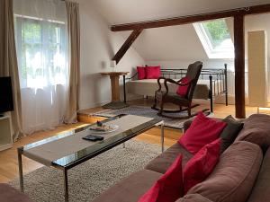 a living room with a couch and a coffee table at Haus Haselmaus - Buntspecht in Schwäbisch Gmünd
