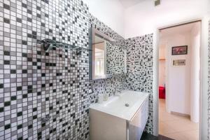a bathroom with a sink and a mirror at Villa Roberta Marina di Campo in Marina di Campo +27 photos