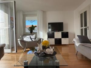 a living room with a couch and a table at Ferienwohnung Sieglinde in Bad Dürrheim
