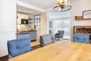 a kitchen and dining room with a table and chairs at Ferienwohnung Jost in Sundern