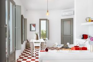 a living room with a checkered floor at Luna Rossa Milos - Cocoon in Provatas +19 photos