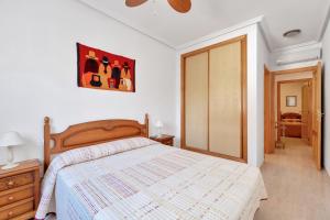 a bedroom with a bed and a dresser and a door at Casa Mario in Puerto Marino +12 photos