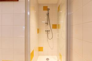 a bathroom with a shower and a toilet at Chalet Arclosan - Val de Tamié in Faverges