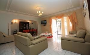 a living room with two couches and a table at Romantic Villa with private Pool in Adeje