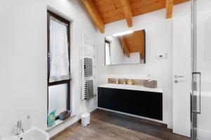 a bathroom with a sink and a mirror at Charmingly Renovated Stone House in Cesara +23 photos