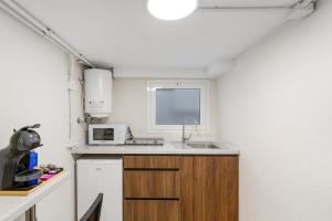 a small kitchen with a sink and a microwave at Atw Studio in Guanarteme +14 photos