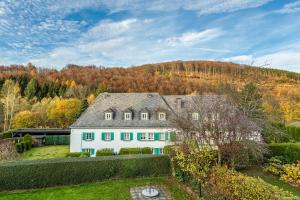 an aerial view of a white house at Appartment Schlossmühle in Olsberg in Olsberg