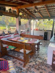 a wooden table in a room with a kitchen at Casa Mimi in Oradea