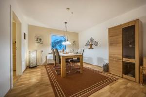 a dining room with a table and chairs at Gästeapartment Hannover in Hannover
