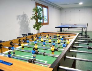 a group of people in a room with pool tables at Casa Senda Bardenas in Cabanillas