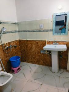 a bathroom with a sink and a toilet at The Plaza Dalhousie - Near Ghandhi Chowk Mall Road in Dalhousie