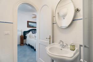 a bathroom with a sink and a mirror at Villa Bella Vista in Capri +30 photos