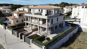 an aerial view of a large white house at Antonia in Can Picafort